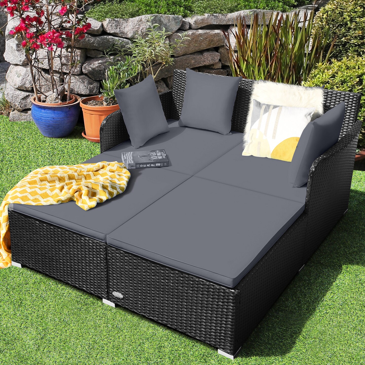 Spacious Outdoor Rattan Daybed With Upholstered Cushions And Pillows