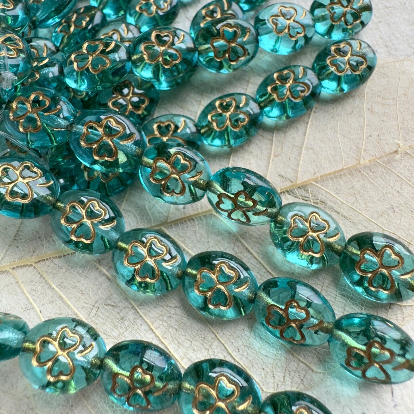 St. Patrick&#x27;s Day Aqua and Gold Shamrock Oval Czech Glass Bead
