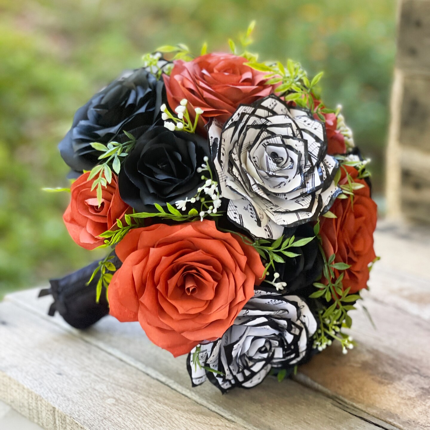 Music note bridal bouquet in black and burnt orange Colors are