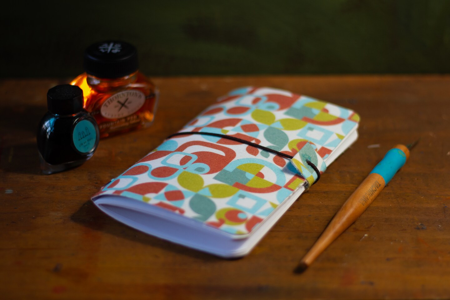 product name is 4x6 travel journal note book with fun pattern cover. Leather and elastic closure.