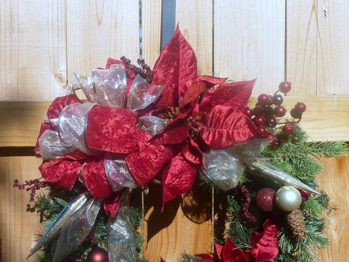 Poinsettia Wreath with Burgundy Bow