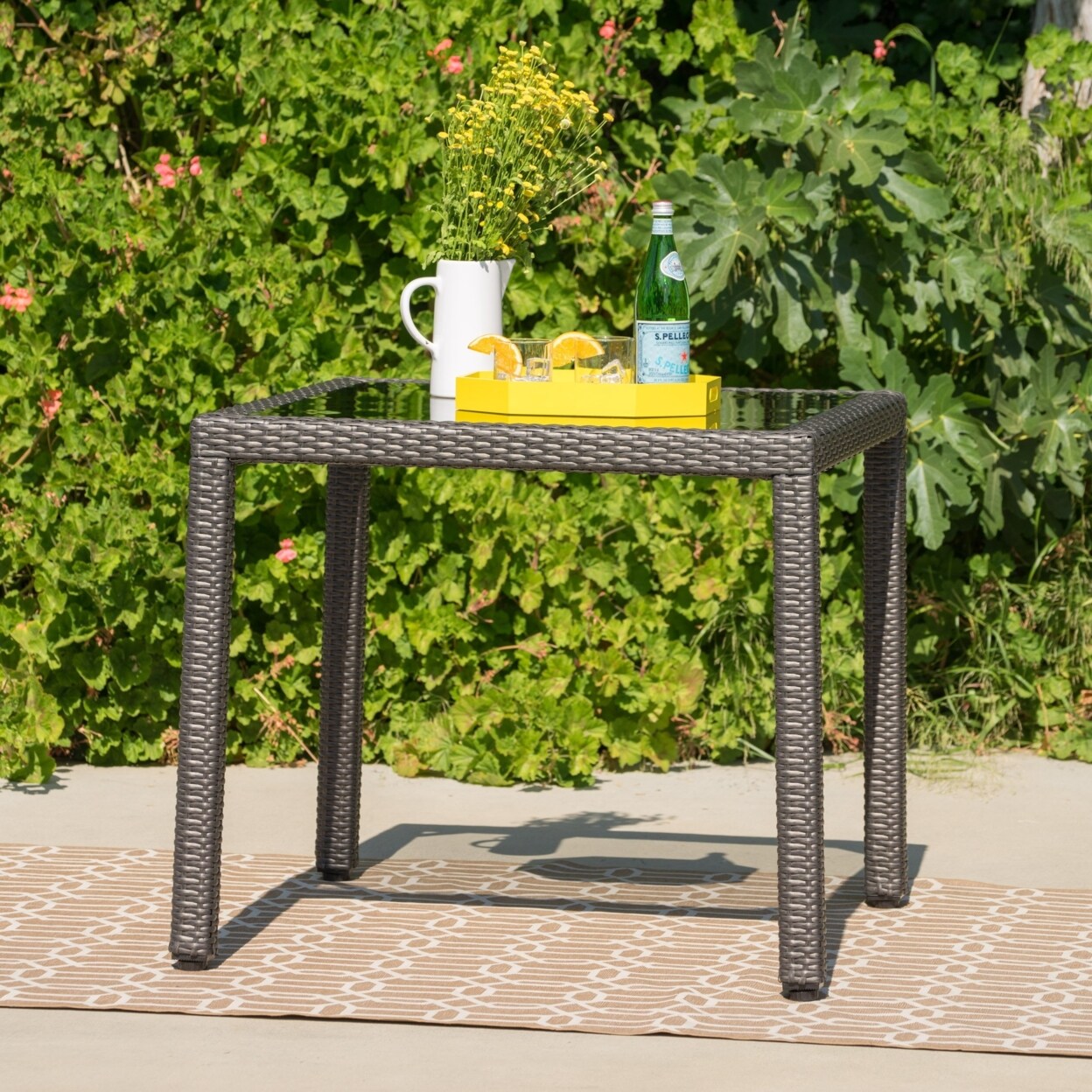 Outdoor wicker dining table with glass top hot sale