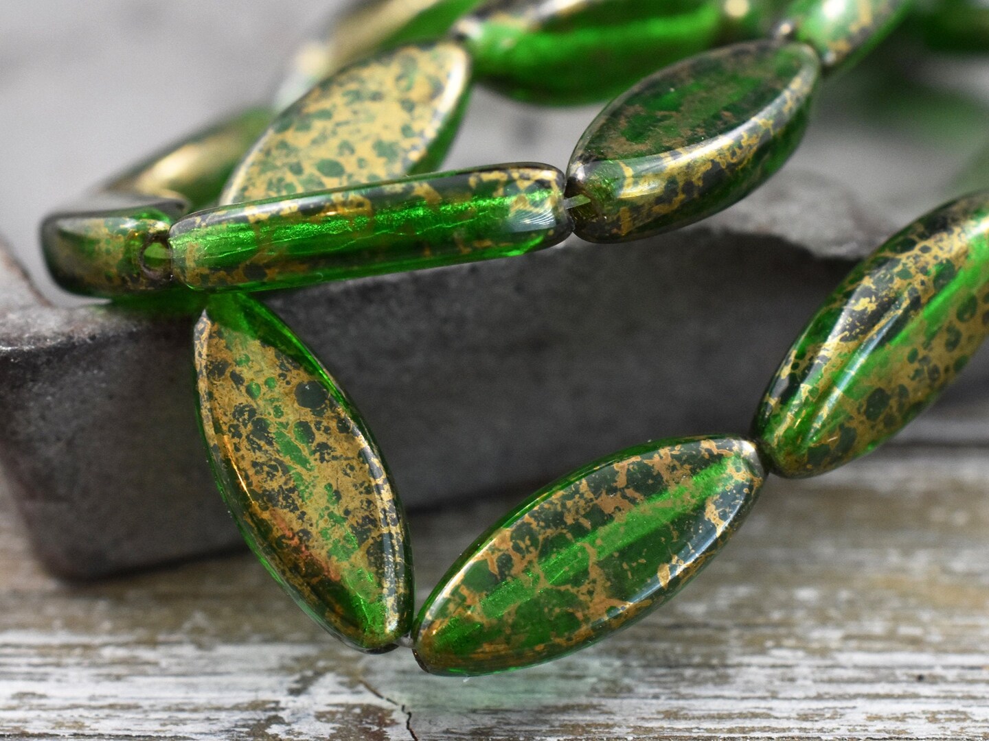 *10* 18x7mm Gold Washed Emerald Green Spindle Beads