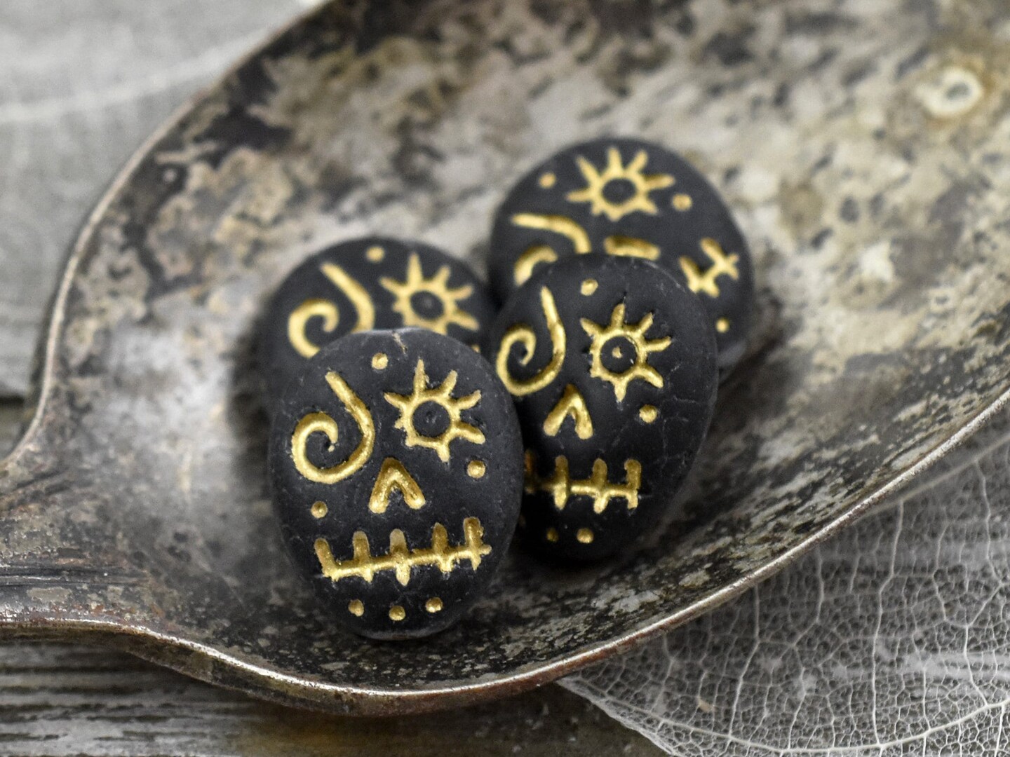 *4* 15x13mm Gold Washed Matte Black Voodoo Face Beads | Michaels