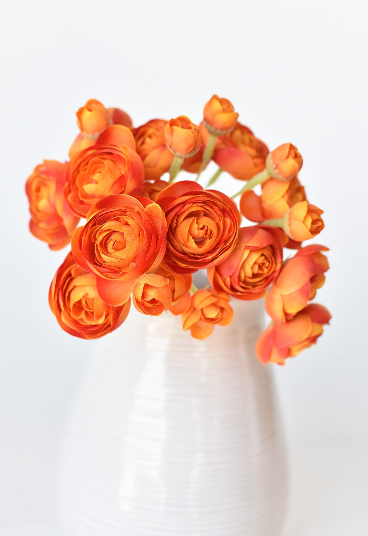 10.5&#x22; Faux Peachy Orange Ranunculus Stem Bundle