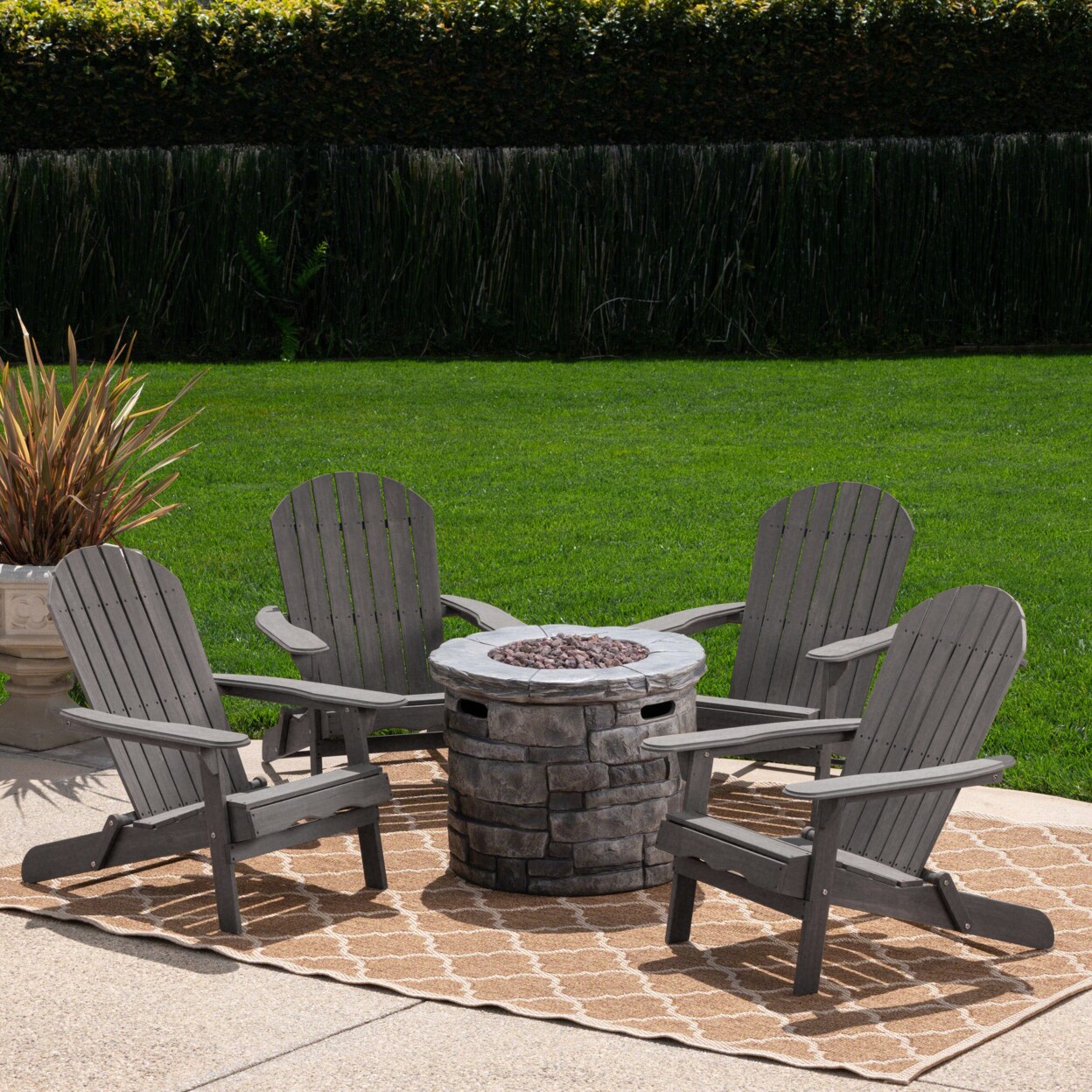 Adirondack chairs around outlet a fire pit