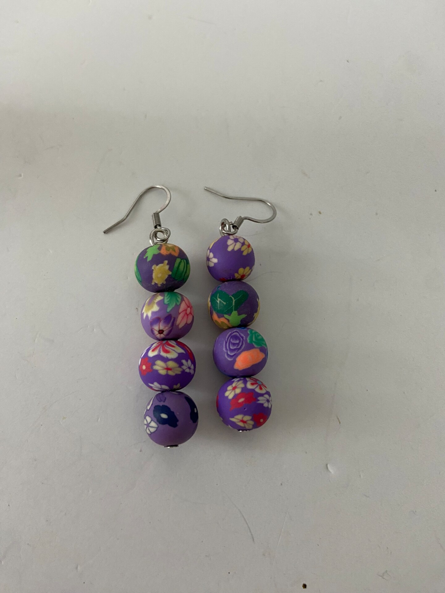 Purple floral clay bead earrings