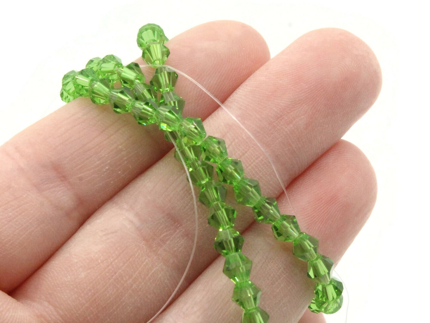95 4mm Light Green Glass Faceted Bicone Beads