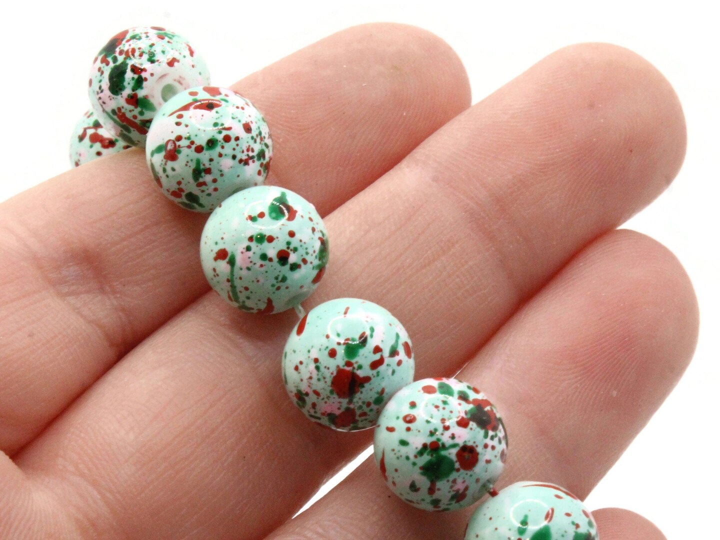 40 10mm Mint Green with Red &#x26; Pink Splatter Paint Smooth Round Glass Beads