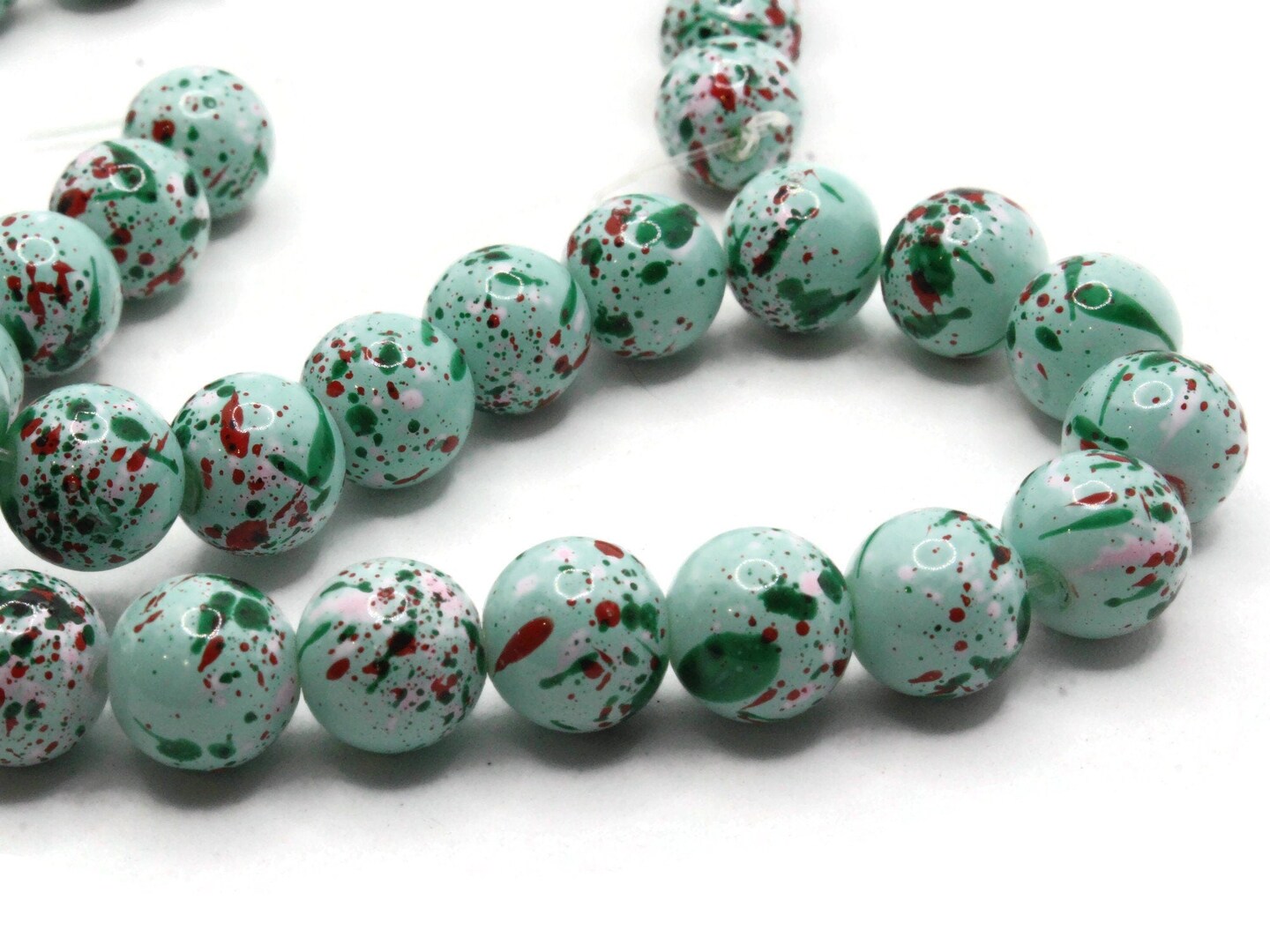 40 10mm Mint Green with Red &#x26; Pink Splatter Paint Smooth Round Glass Beads