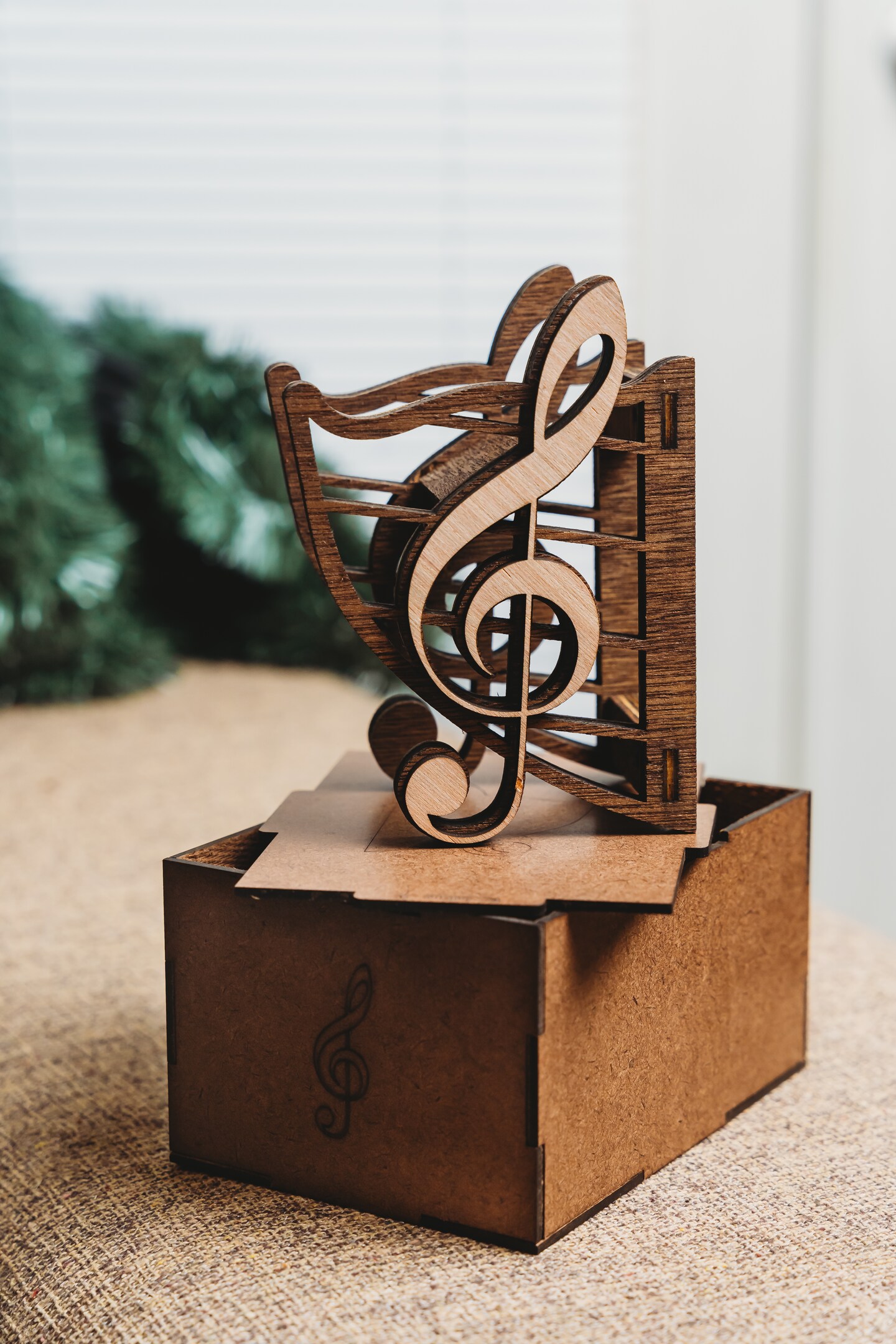 product name is Guitar Wall Mount in Gift Box Guitar Hanger with treble clef design for straight or angled head guitars