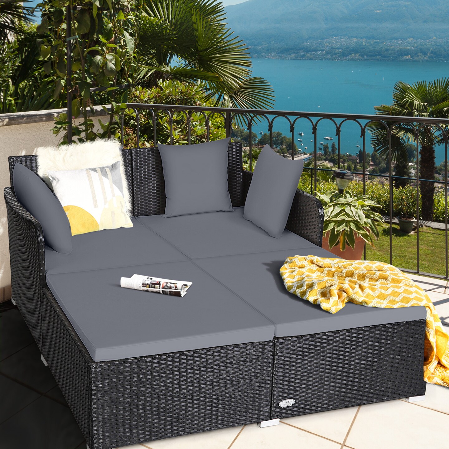 Spacious Outdoor Rattan Daybed With Upholstered Cushions And Pillows
