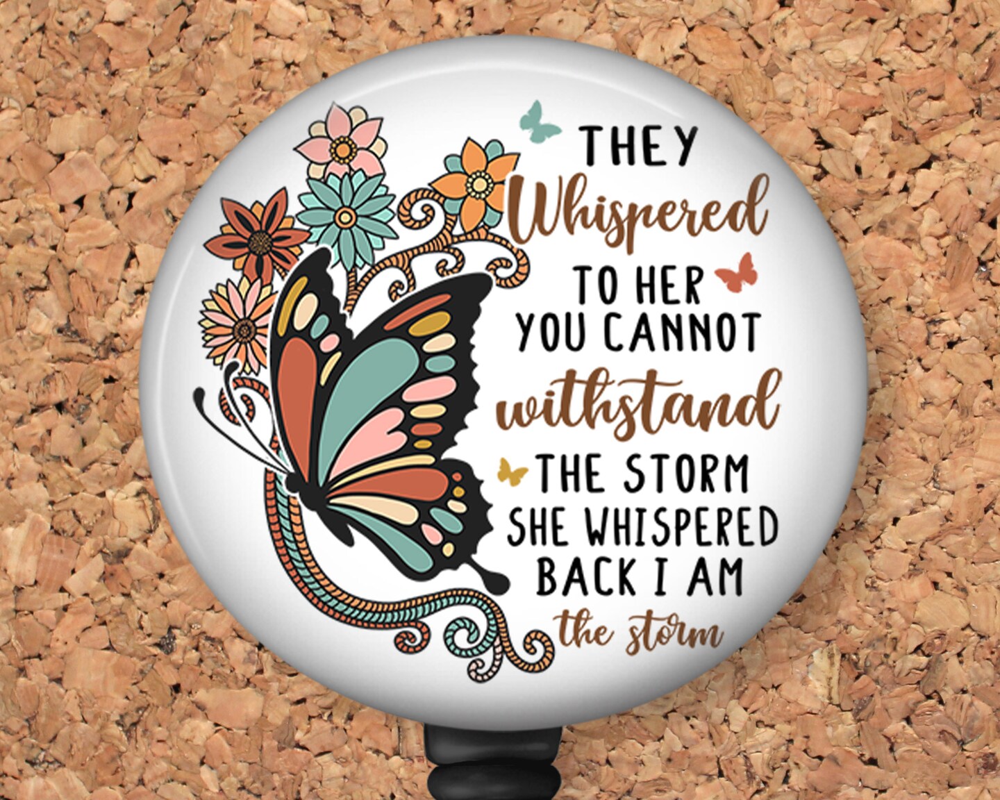 I am the Storm Badge Reel ID Holder featuring a beautiful butterfly