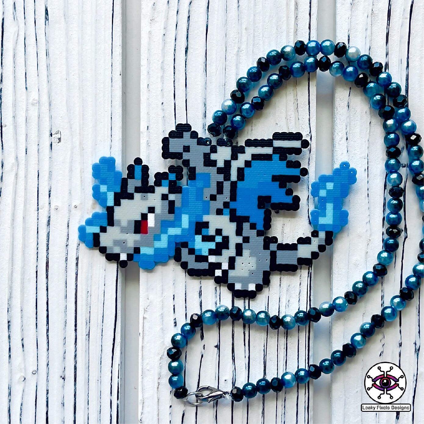 Charizard X Perler Necklace | MakerPlace by Michaels Charizard X Perler Necklace | MakerPlace by Michaels
