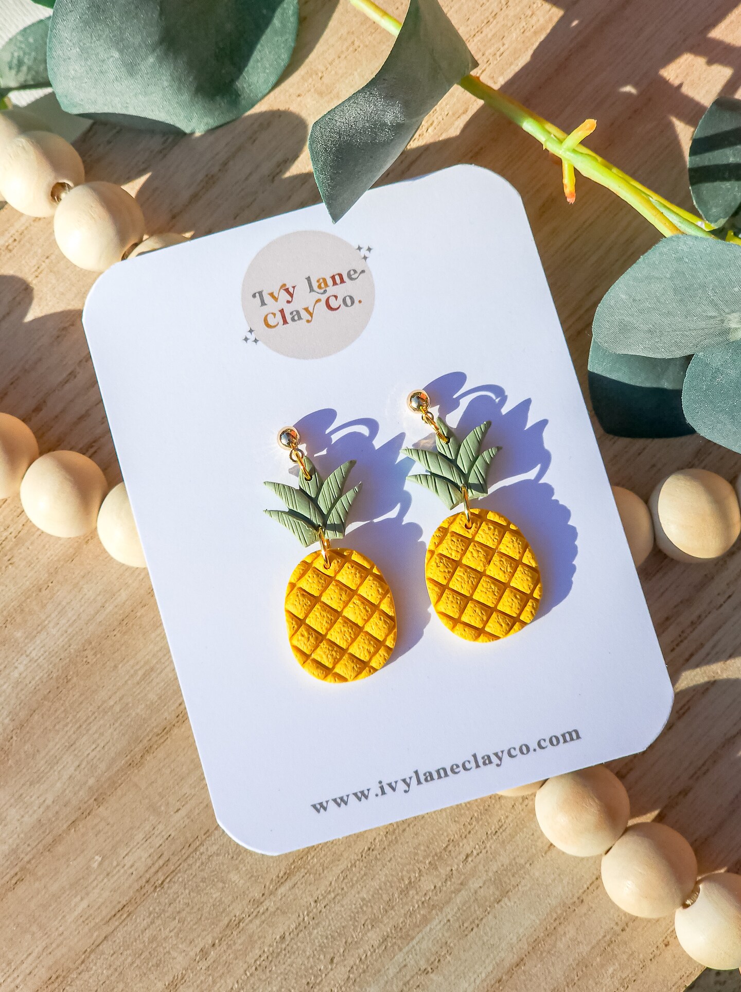 Pineapple store clay earrings