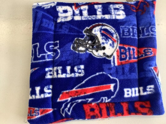 product name is Buffalo Bills fleece helmet logo pennant Cuddle mat crate pad travel bed reversible