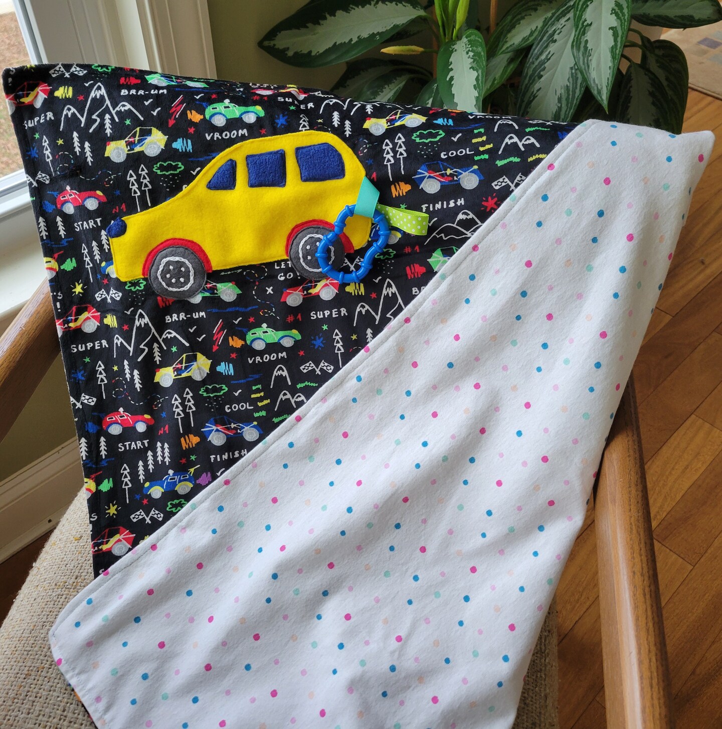 product name is Race Car Minky Blanket with Ribbons, Car Theme Lovey, Gift for Birthday Boy or Girl, Welcome Home or Baby Shower