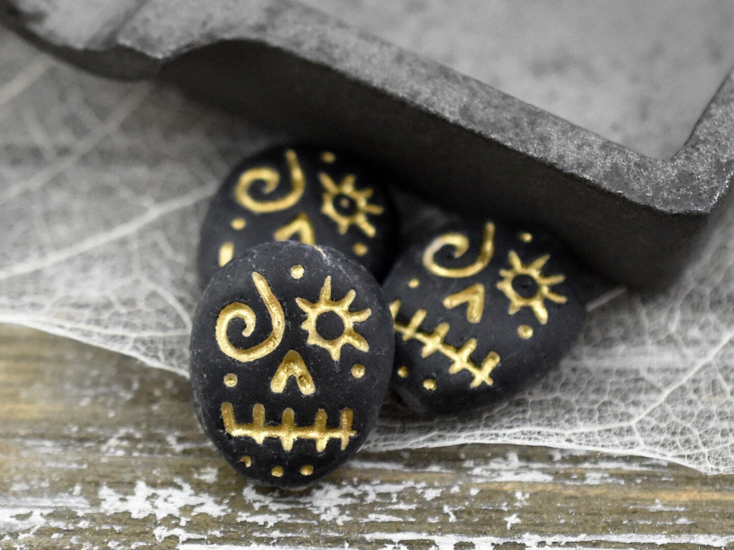 *4* 15x13mm Gold Washed Matte Black Voodoo Face Beads | Michaels