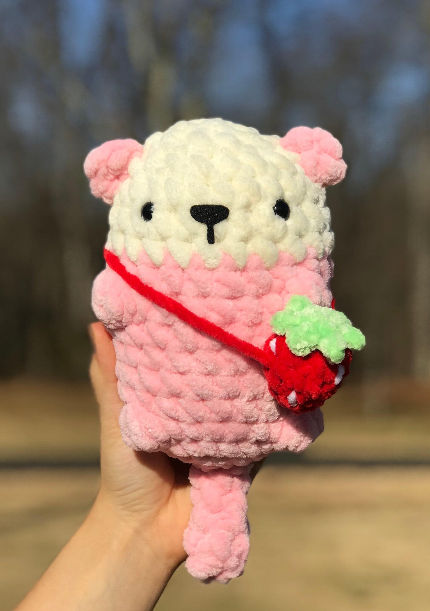 product name is Crochet Strawberry Otter, Pink Otter Plushie, Chubby Stuffed Animal, Strawberry Decor, Gifts for