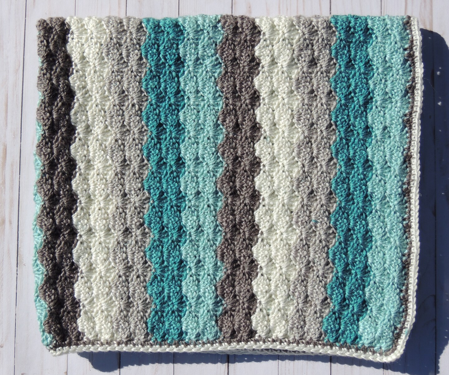 product name is Crochet Blanket Tan Teal Shell stitch