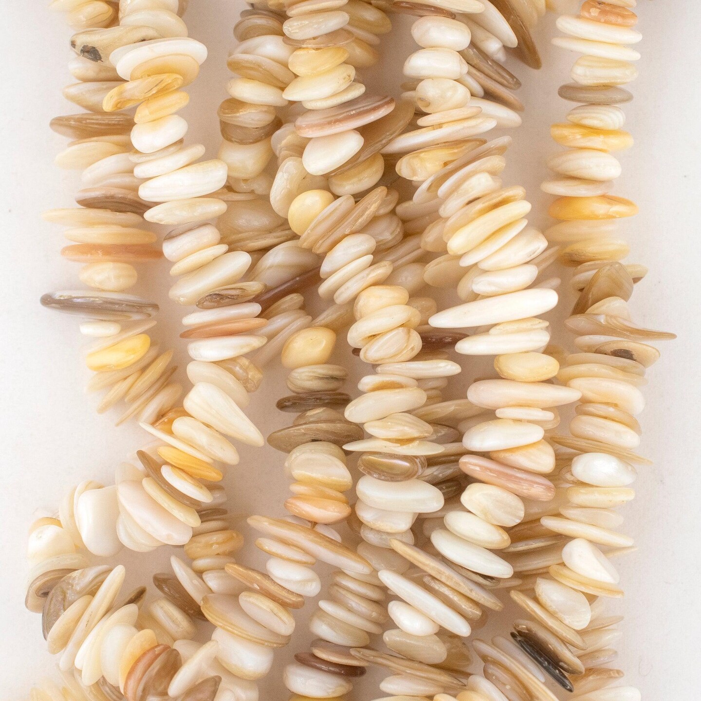 The Bead Chest Cream Oval Chip Shell Beads 4-12mm White Chips 30 Inch Strand