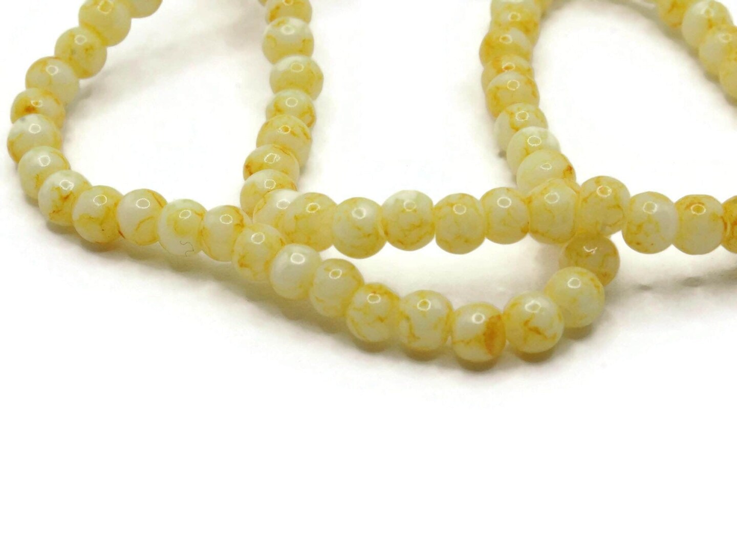 100 4mm White with Yellow Splatter Paint Smooth Round Glass Beads