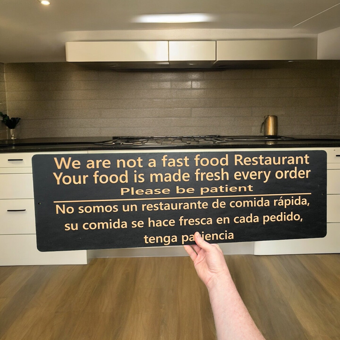 Sign - English &#x26; Spanish - We are not a fast food restaurant Please Be Patient
