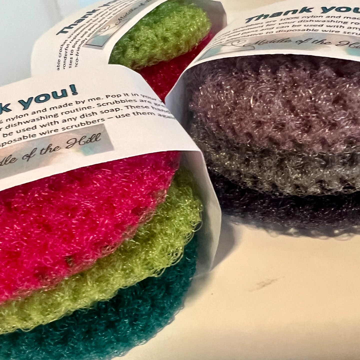 product name is Crochet reusable dish scrubbies are nylon, handmade, washer safe, and sold as a set of 3, you pick the colors
