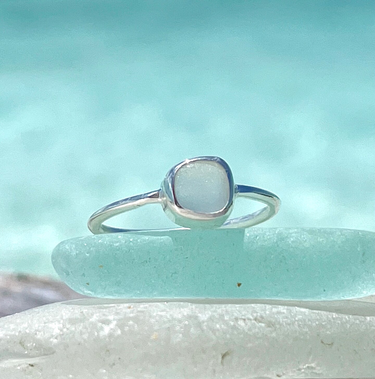 White 2024 sea glass ring with gemstones set in silver