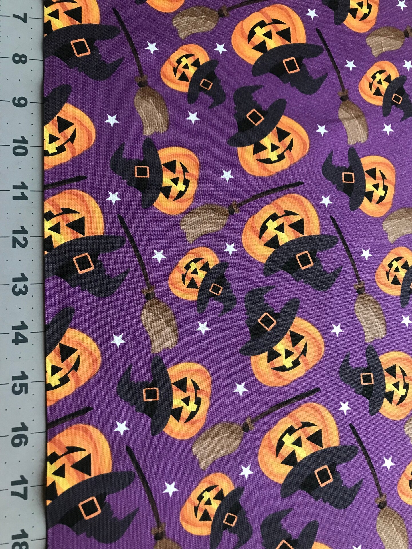 Halloween Smiling Pumpkins and Witches Brooms on Purple 100% Cotton Fabric