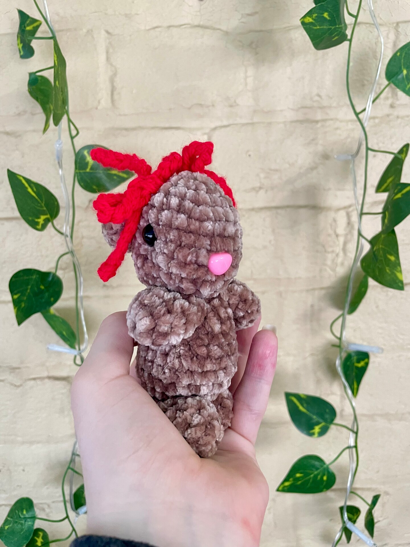 product name is Crochet Bunny Plushie with Cute Bows on It's Head