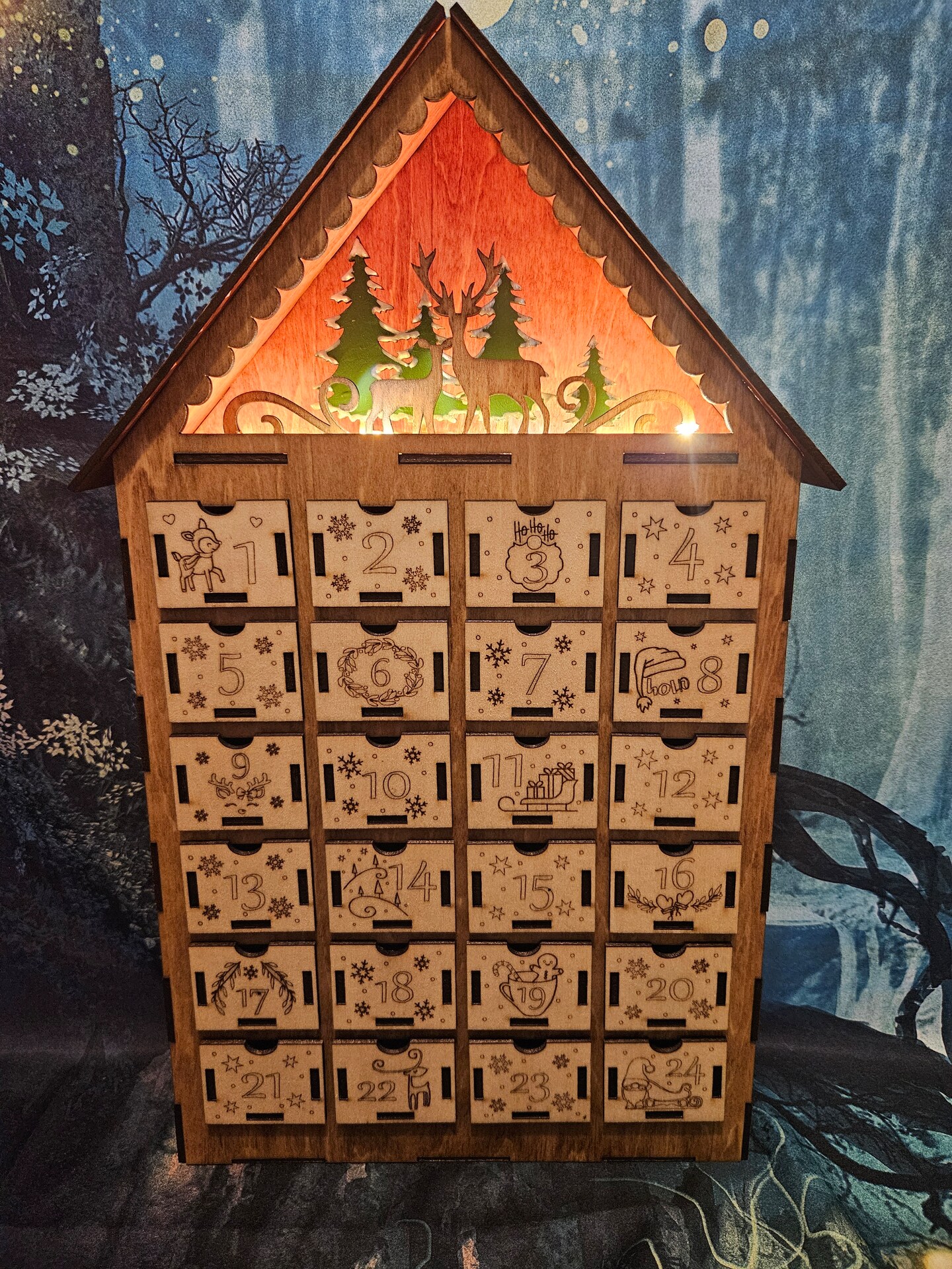 Lighted Christmas advent calendar with 24 drawers to hide treats for each day!