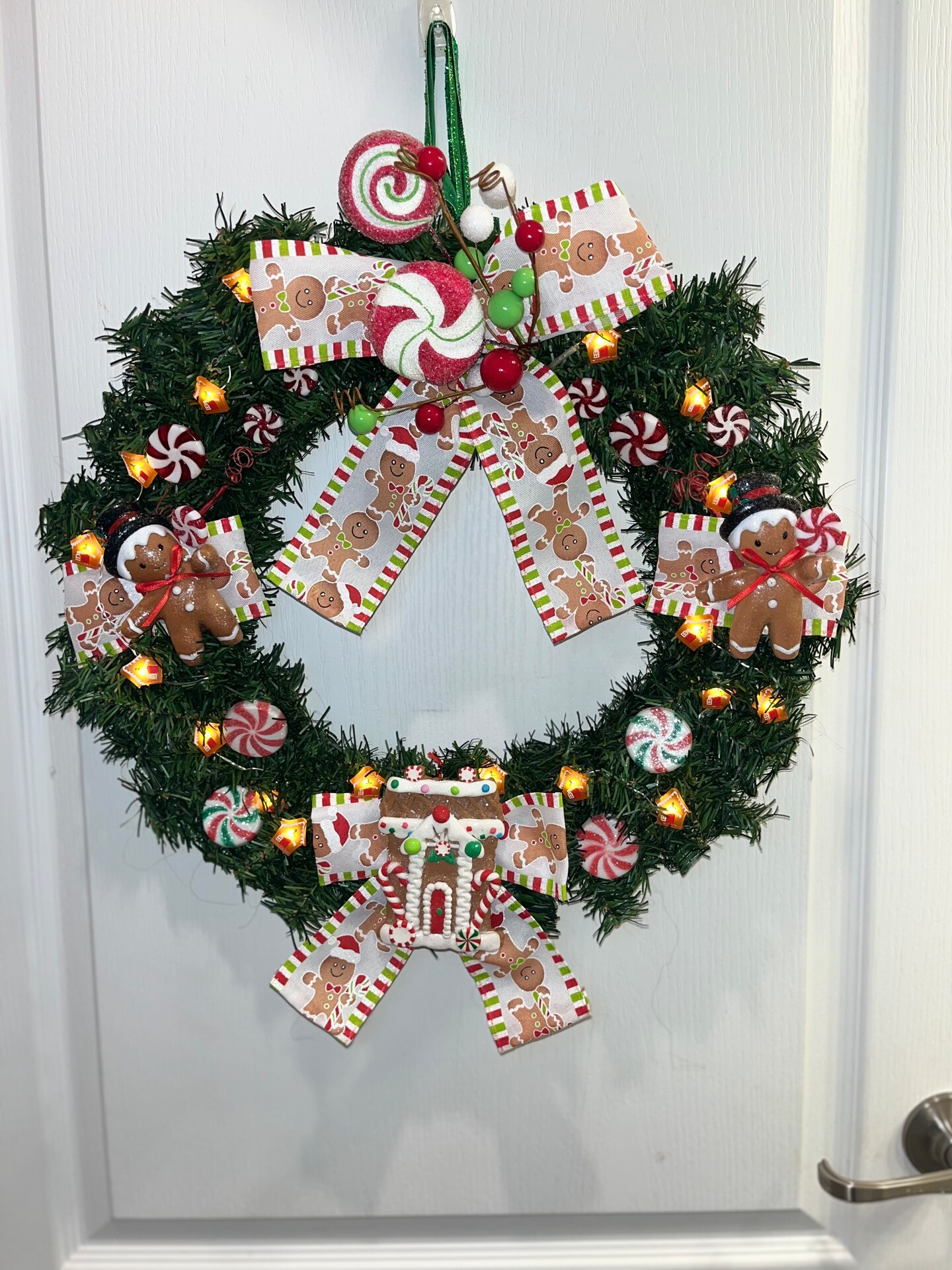 Prelit Gingerbread Christmas Wreath; Candy Peppermint Holiday Decor with  Lights | MakerPlace by Michaels, image size:810x1080