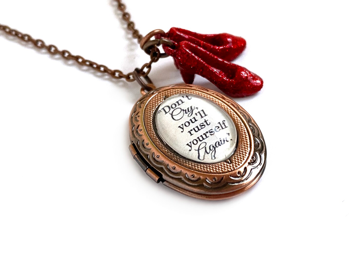 The Wonderful Wizard of Oz Locket with Sparkly Ruby Red Slippers Charms,  Don't Cry Tin Man Quote Jewelry, 1-2 Photo Locket | MakerPlace by Michaels, image size:1440x1080