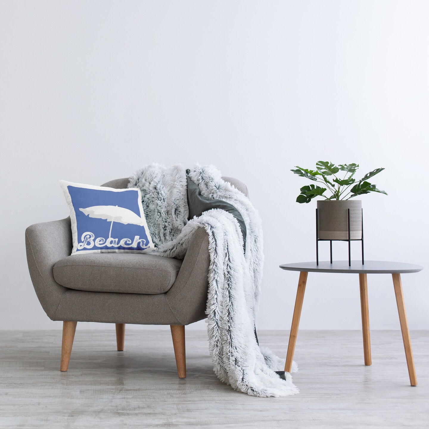 Beach Umbrella on Blue Design by GraffiTee Studios Throw Pillow