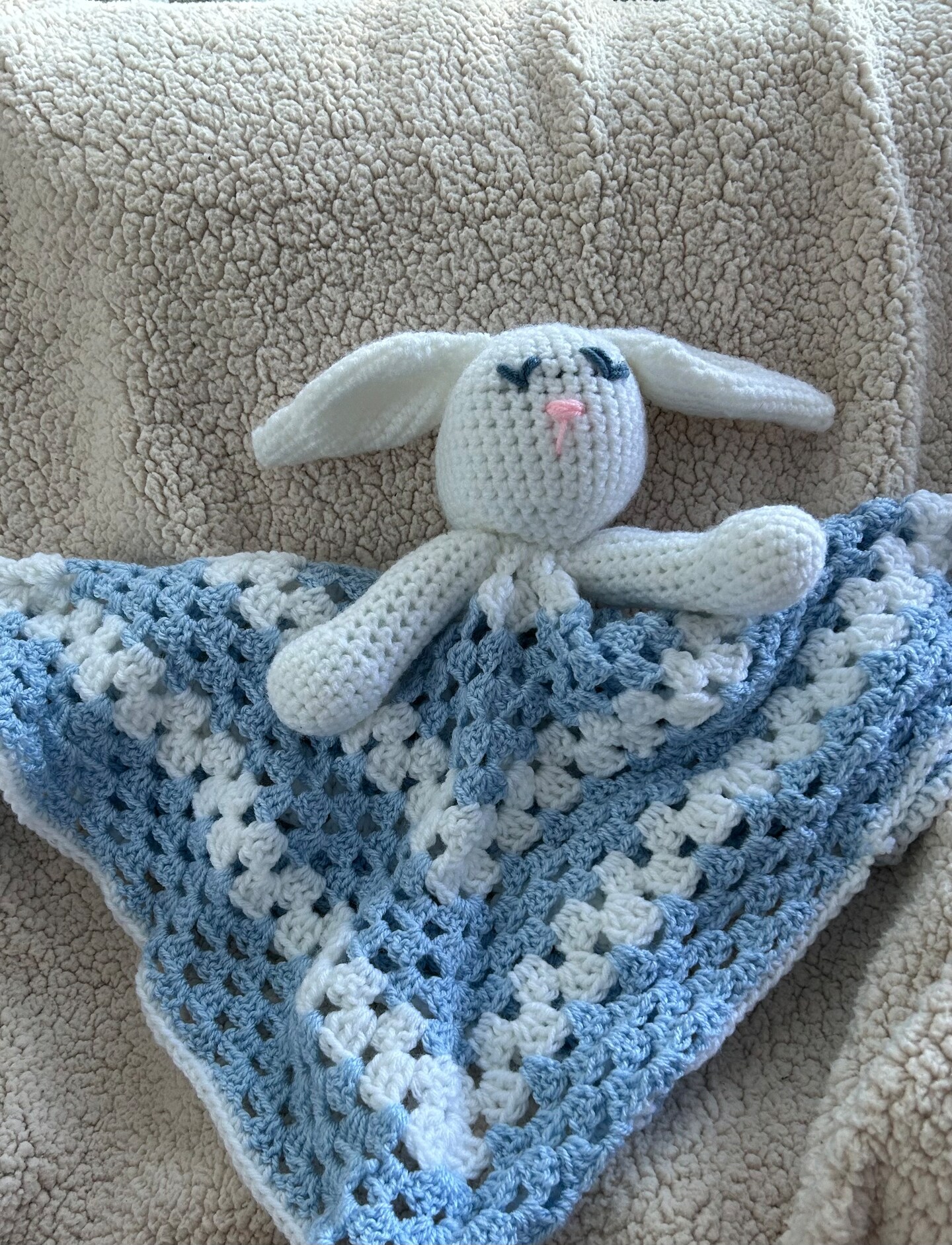 product name is Blue bunny lovey approximately 28 inches, soft, machine washable and comes in solid blue or blue and white.
