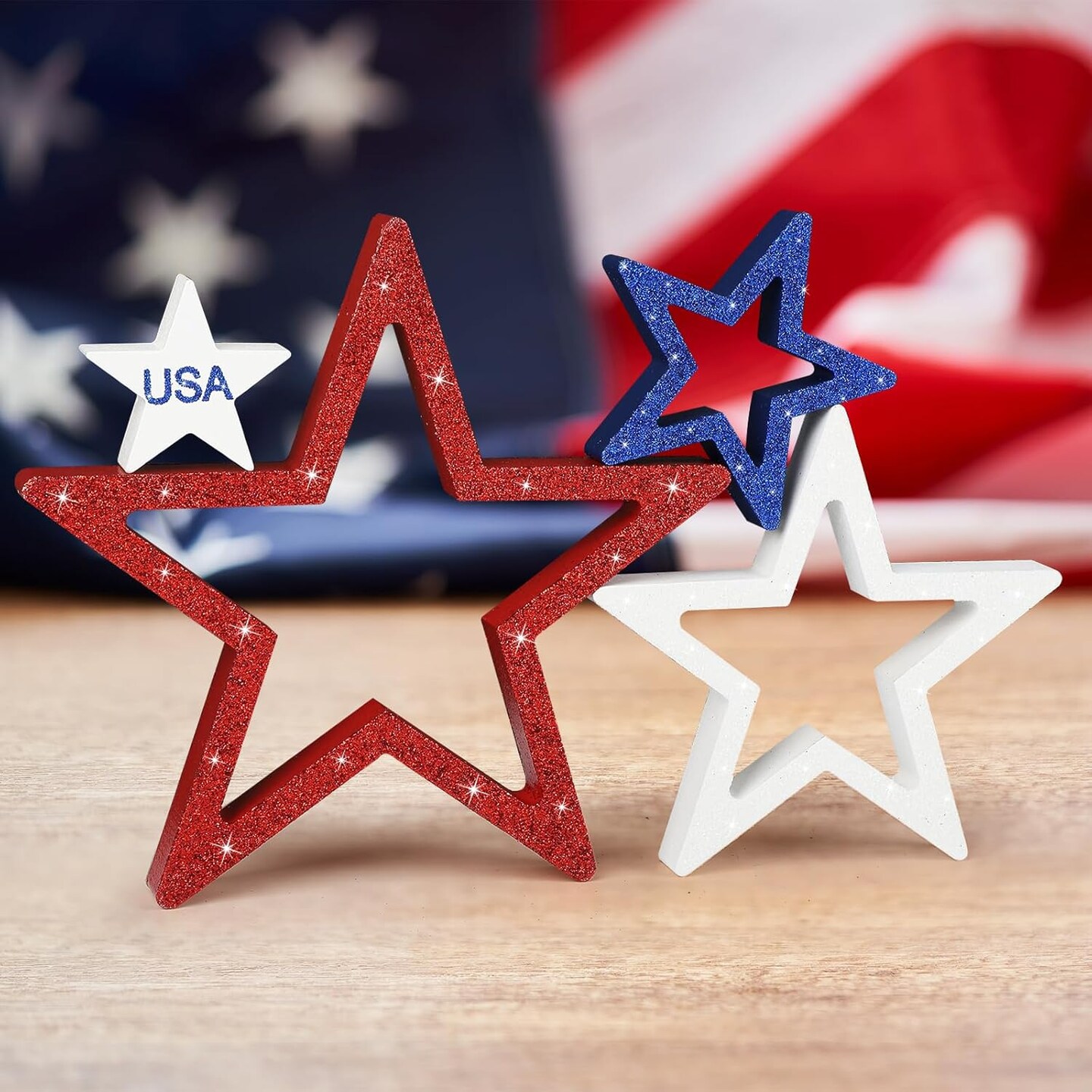 Set of 4 glittery red, white, and blue stars for 4th of July decor.