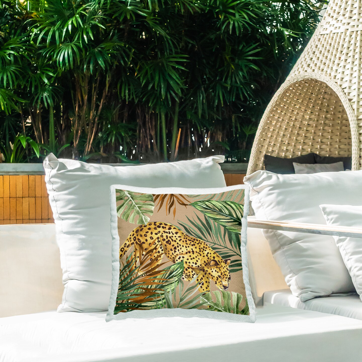 Stupell Industries Palm Leaves Surrounding Leopard Outdoor Printed Pillow design by Janet Tava, 18 x 7 x 18