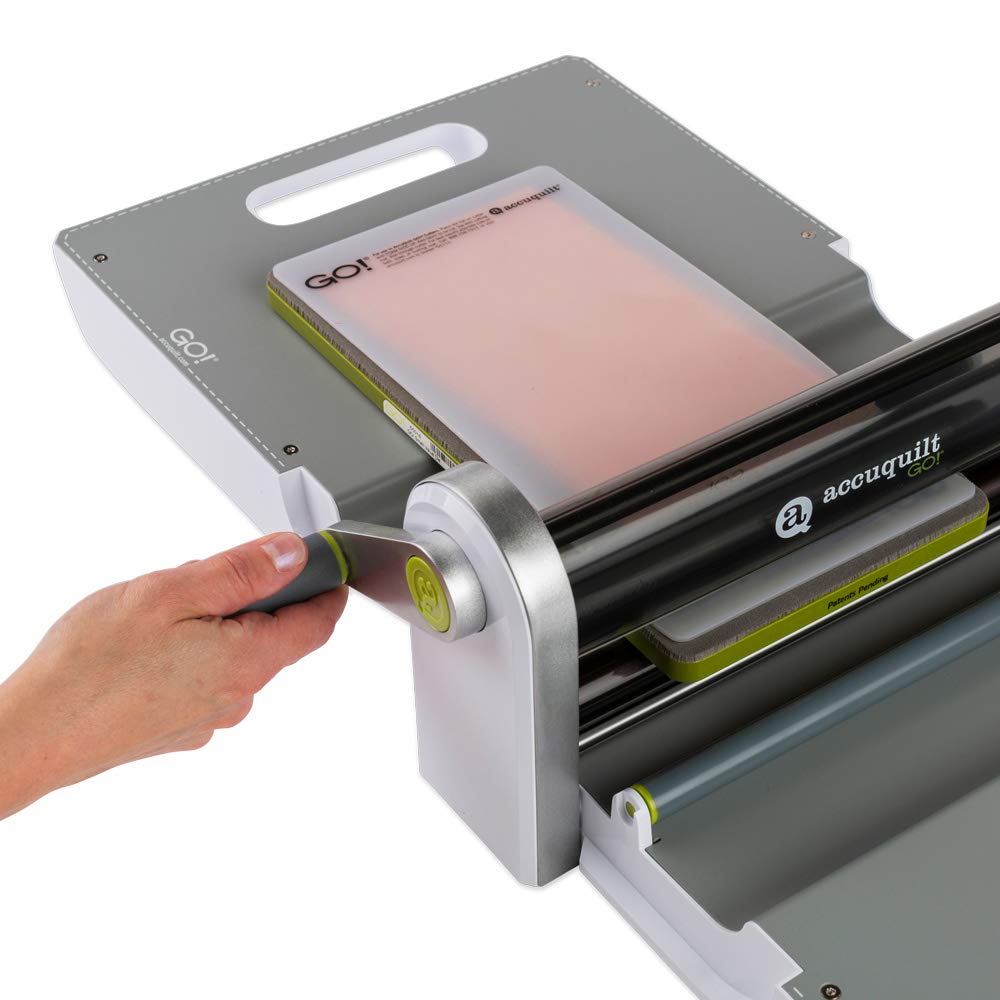 AccuQuilt GO! Fabric Cutter Starter Set including the GO! Fabric Cutter, Original Handle, GO! Value Fabric Cutting Die, GO! 6&#x201D; x 12&#x201D; Cutting Mat, 20 Pg Pattern Book, and Die Pick.