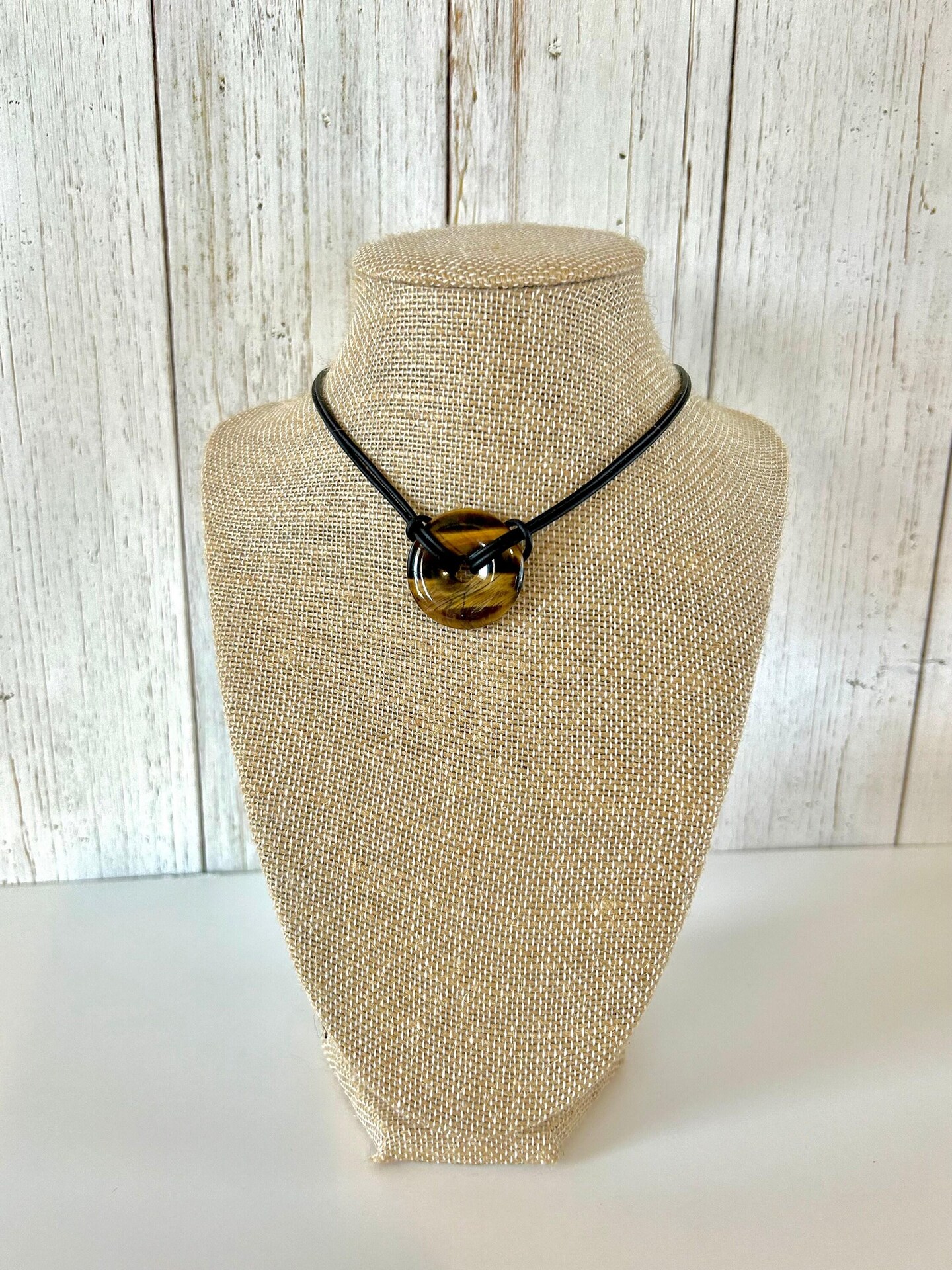 product name is Tiger Eye Gemstone Necklace with Leather Cord