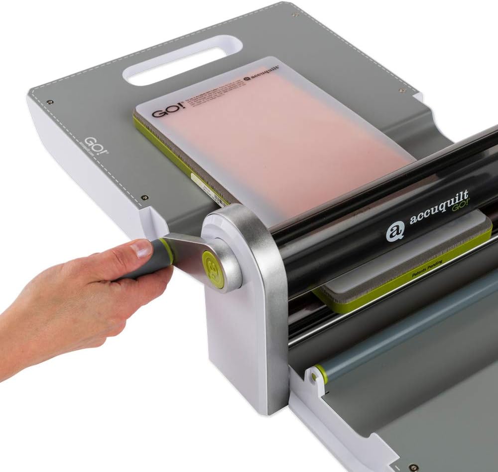 AccuQuilt GO! Fabric Cutter Starter Set including the GO! Fabric Cutter, GO! Value Fabric Cutting Die, GO! 6&#x201D; x 12&#x201D; Cutting Mat, 20 Pg Pattern Book, and Die Pick.