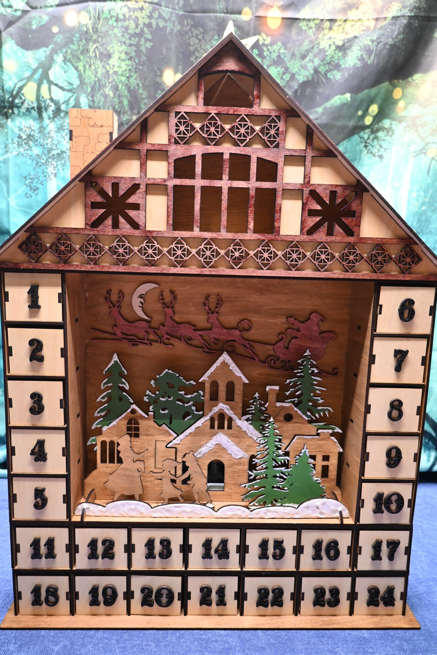 Large lighted Christmas advent calendar with 24 drawers to hide treats for each day!