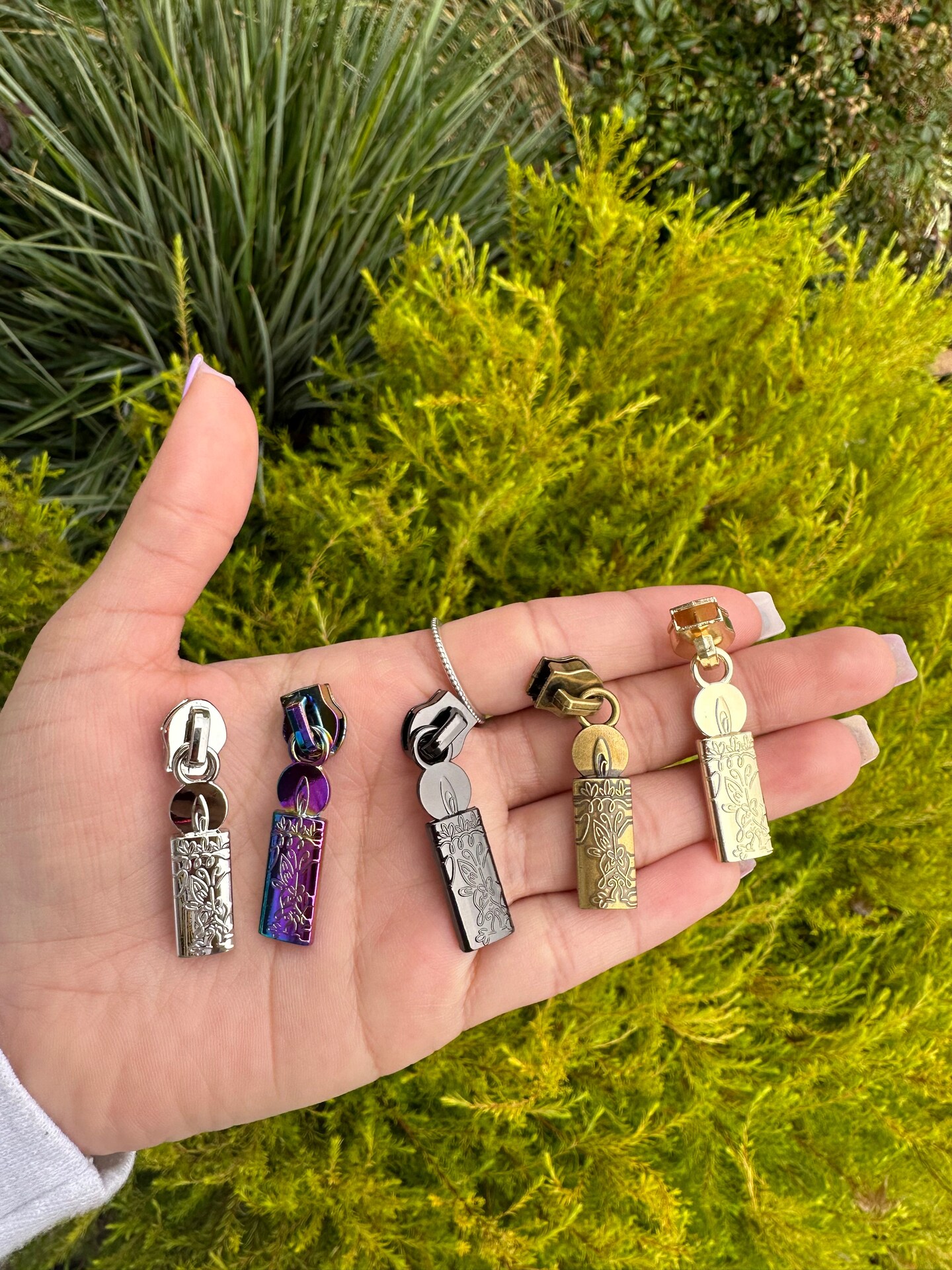 Candle zipper pulls