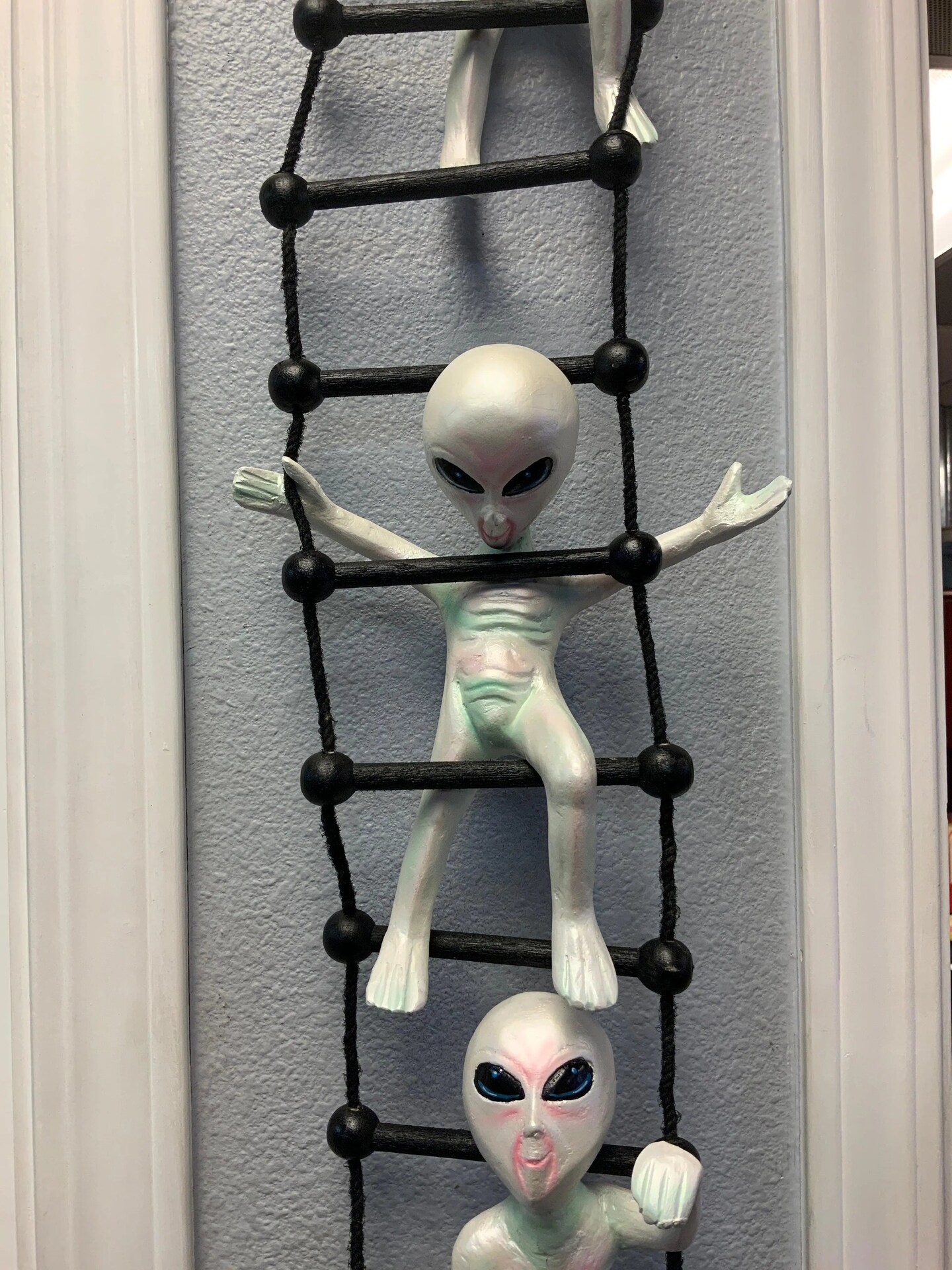 Aliens on Rope Ladder Statue