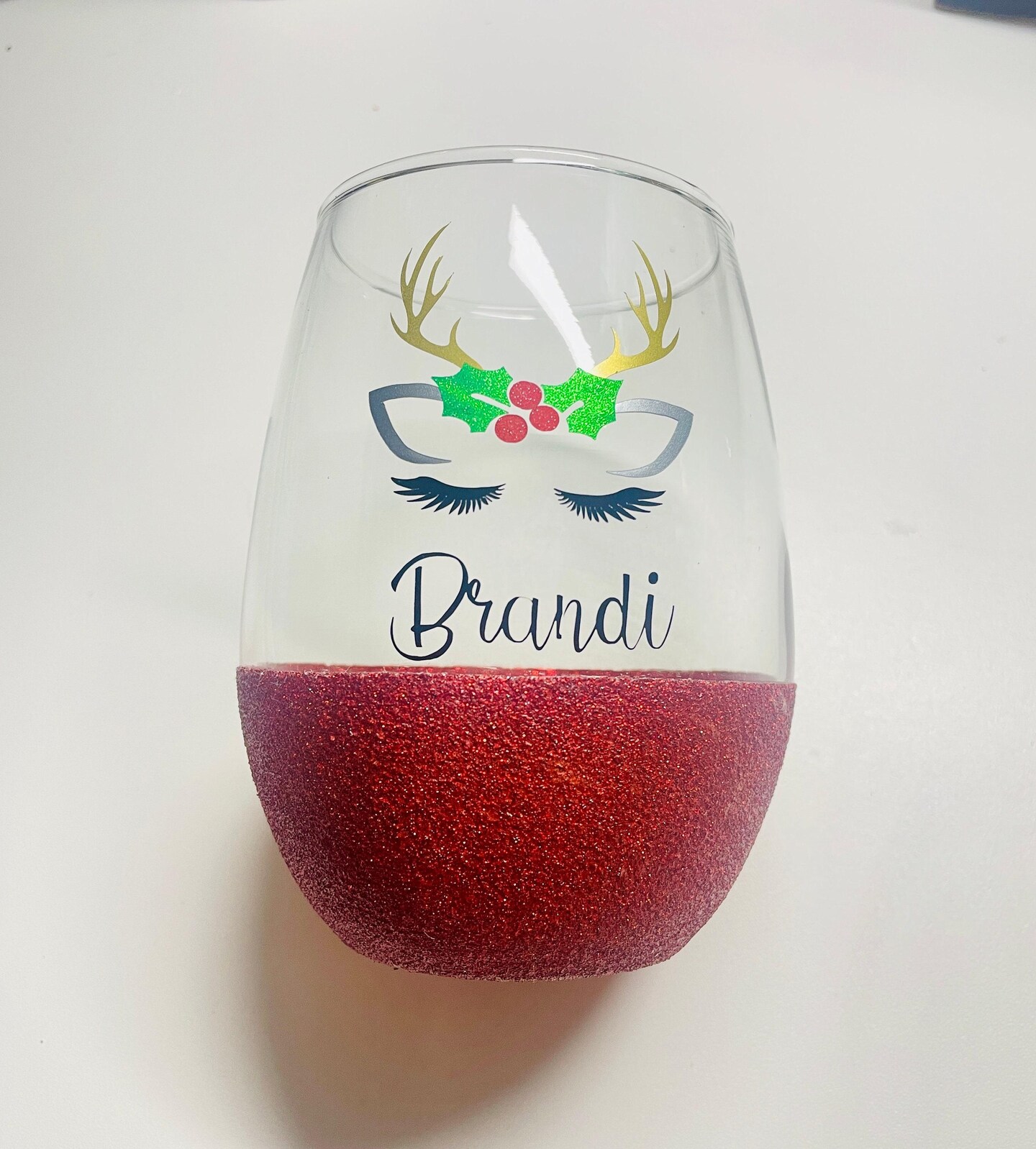 Glittered good reindeer hand painted wine glasses