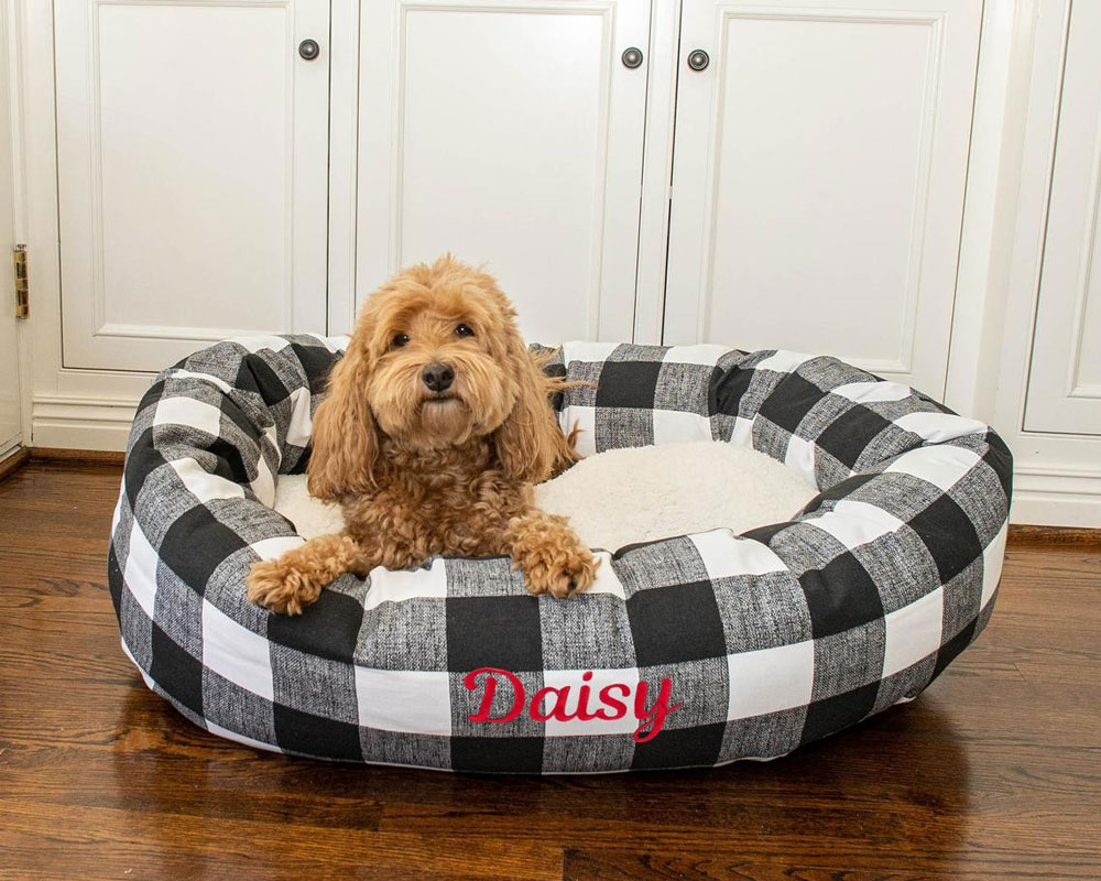 product name is Majestic Pet Anderson Check Sherpa Personalized Calming Dog Bed Washable Cozy Fluffy Donut Dog Bed