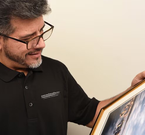 Designer holding a frame