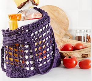 Image of a purple crochet grocery bag.
