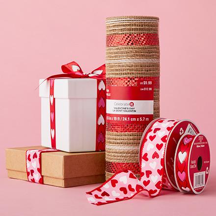 Boxes, ribbons and wrapping paper featuring heart shapes