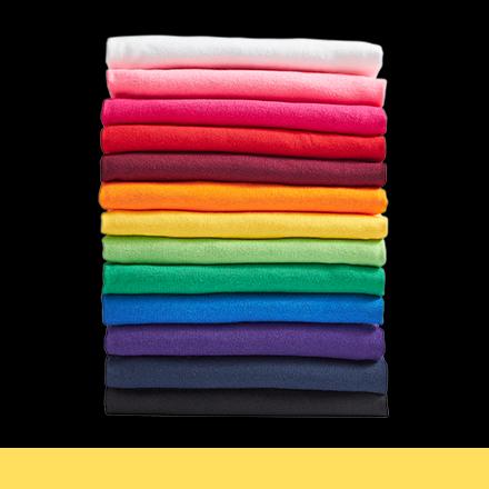 stack of folded t-shirts in rainbow color order